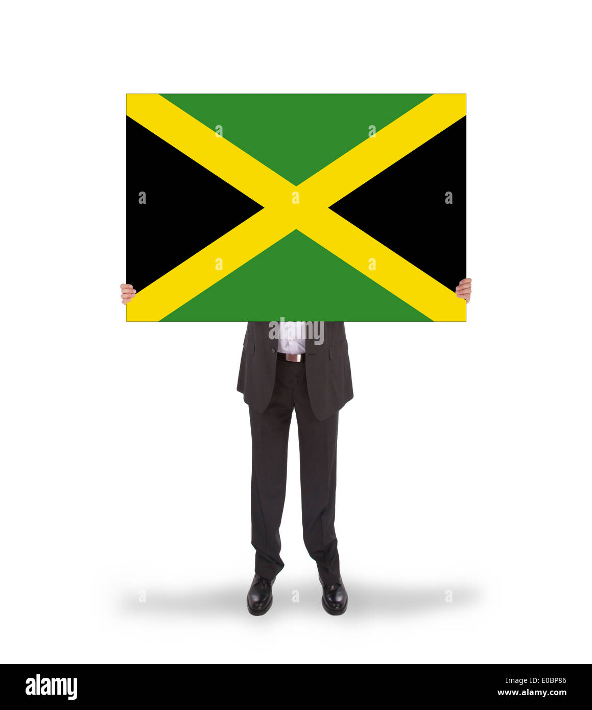 Businessman holding a big card  flag of Jamaica  isolated on white Stock Photo