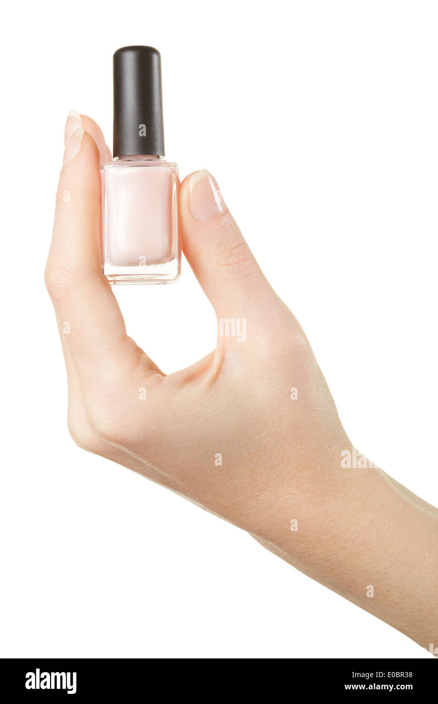 Woman hand holding pink nail polish bottle Stock Photo
