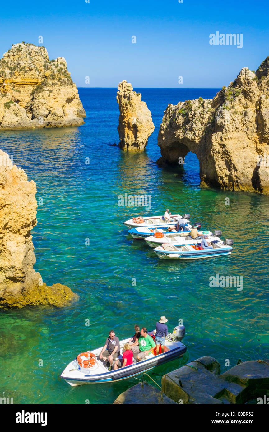 Tourist boats Ponta da Piedade rock cliffs near Lagos Algarve Portugal EU Europe Stock Photo