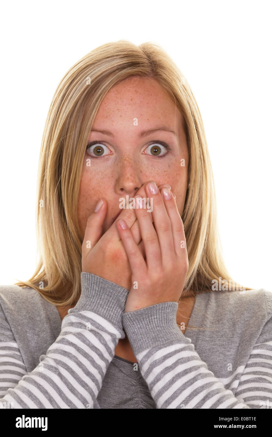 An unsuspecting woman is stunned. Got a fright and helplessness Stock Photo
