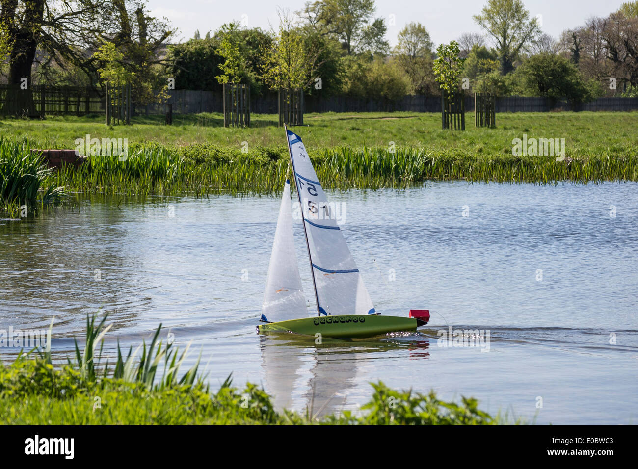 Model yacht sailing on Rick Pond, Home Park, Kingston, Surrey, England