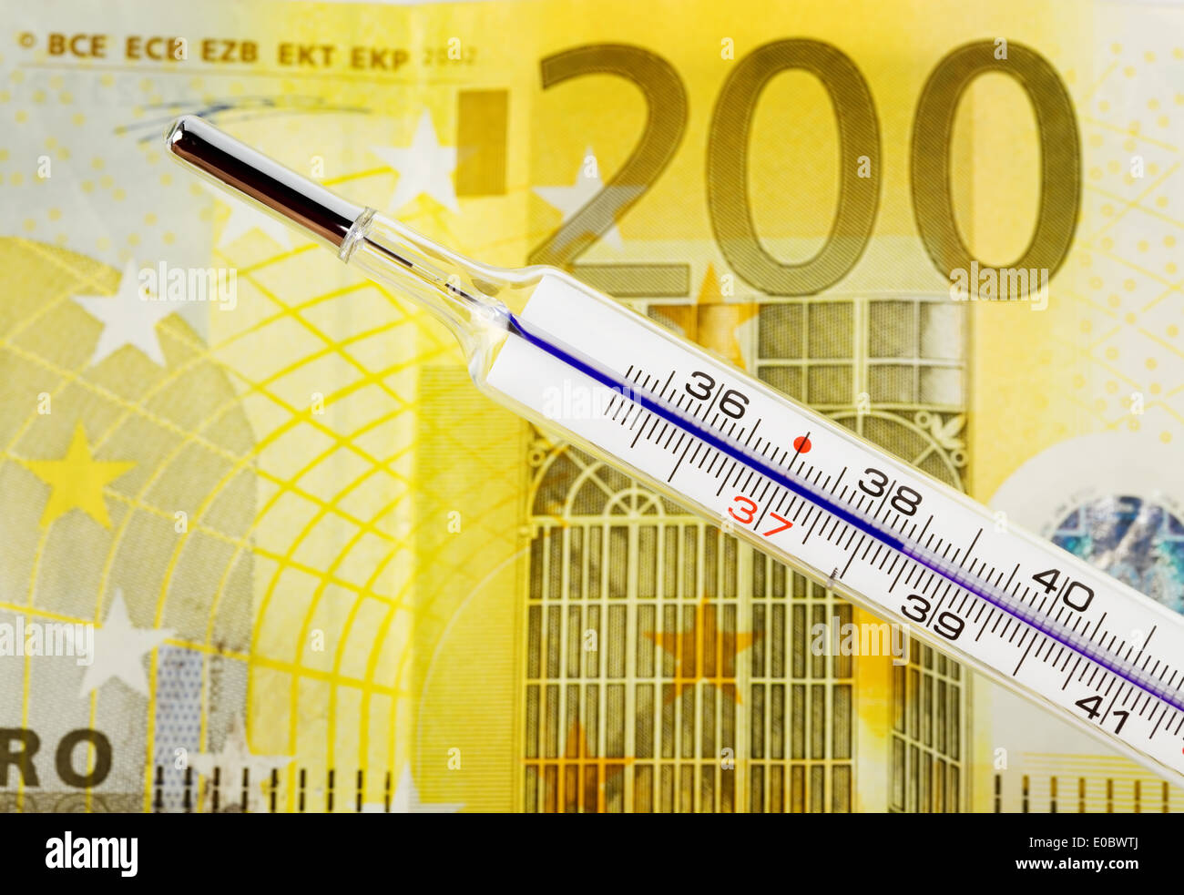 Euromoney and fever thermometer. Economic situation and crisis in Europe., Eurogeld und Fieber Thermometer. Konjunktur und Krise Stock Photo
