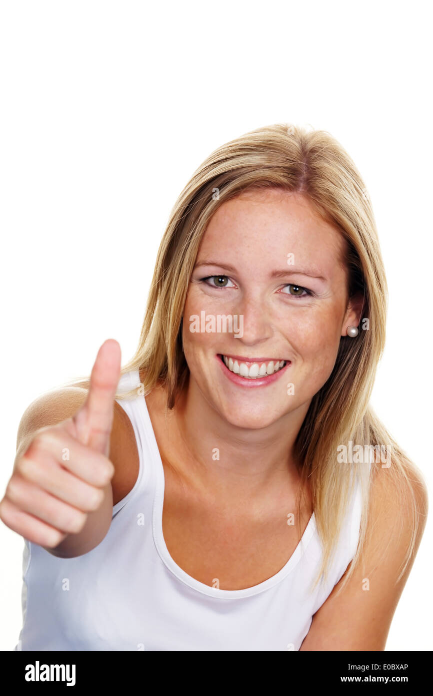 A young, successful woman keeps the fingers crossed upwards. Symbolic picture for success, more exempt to white background, Eine Stock Photo