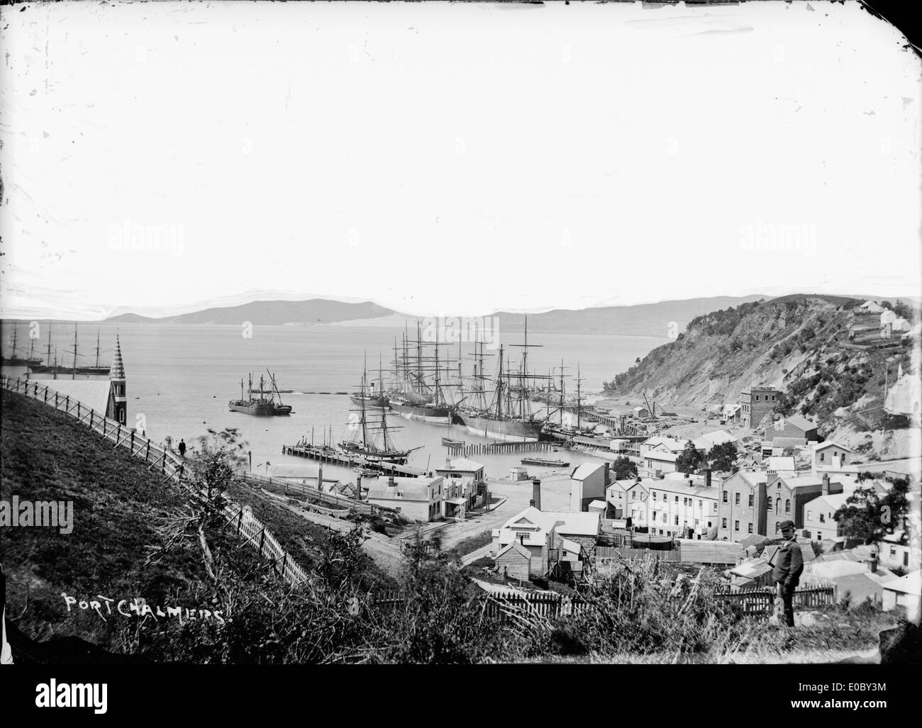 View of old Port Chalmers looking from the hill above the harbour, looking down towards the wharves, 1870s Stock Photo