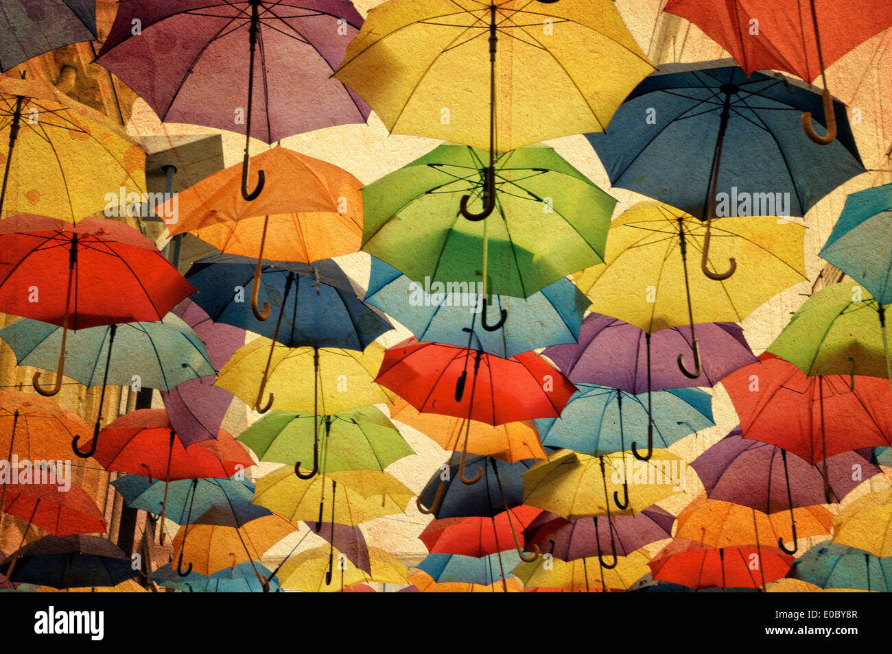 Colorful umbrella street decoration, on old grunge paper background