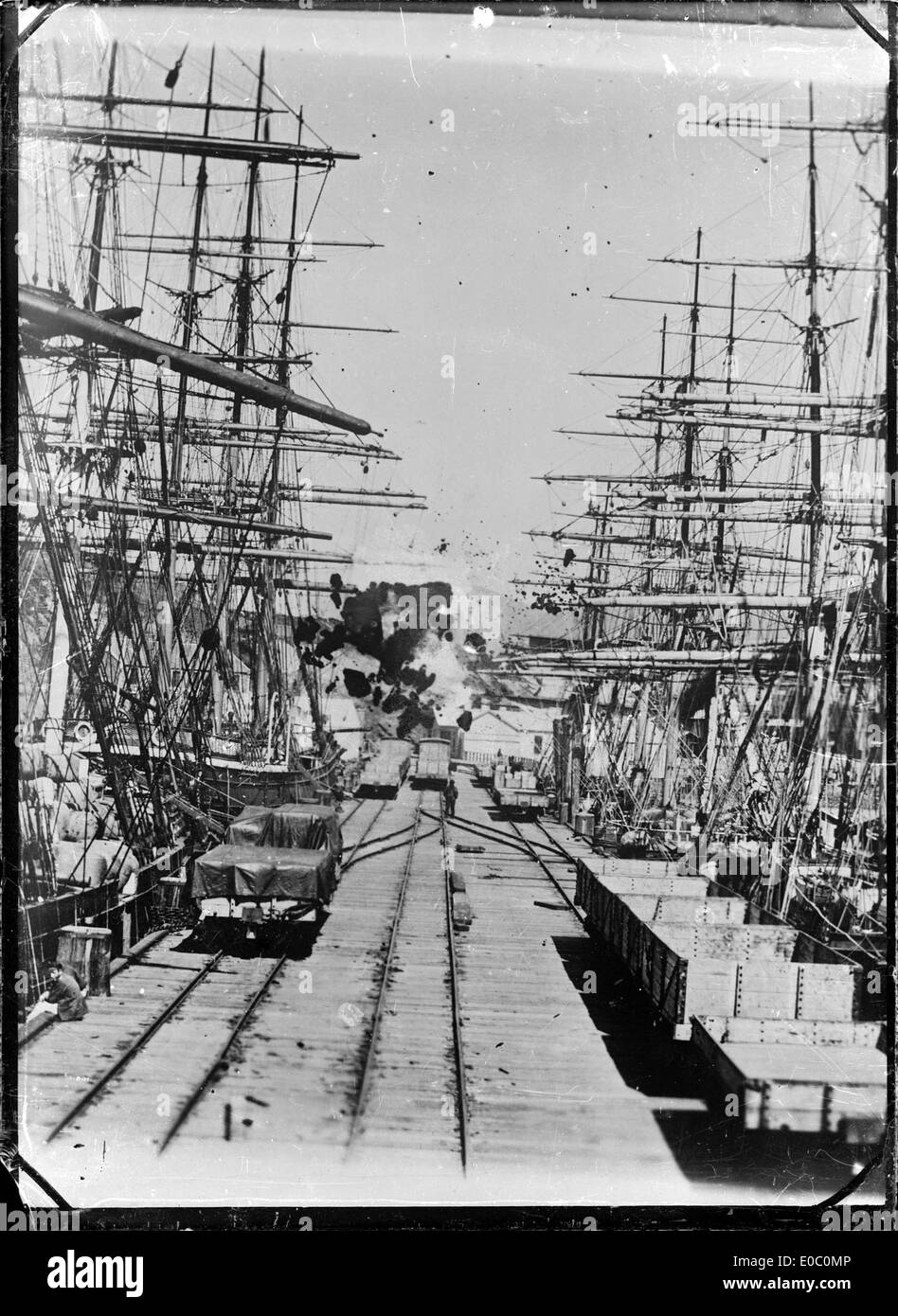 Close-up view of a Port Chalmers wharf and ships loading, 1870s Stock Photo