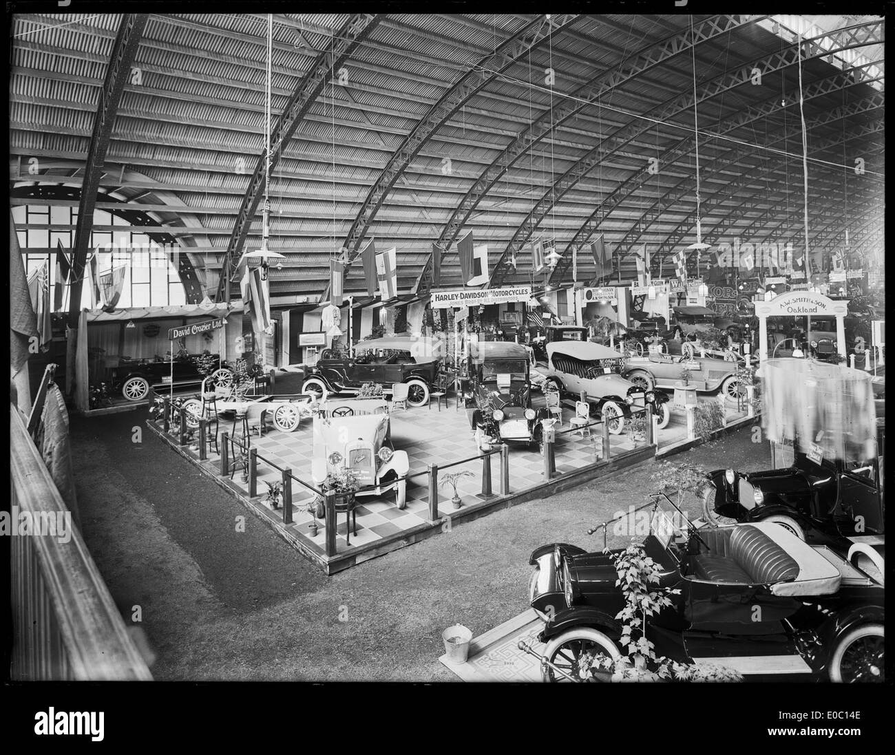 A vintage photo from the Olympia Motor Show held at King Edward Barracks in Christchurch during the 1920s, showcasing early motorcars and vintage automobiles at the time. This event highlights the evolution of car shows in the early 20th century. Stock Photo