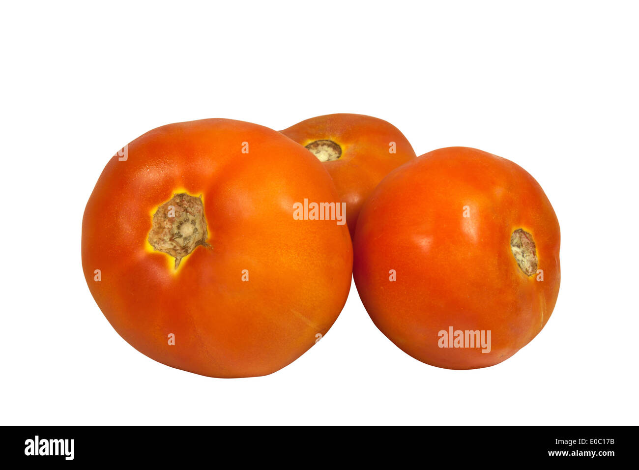 three isolated red tomatoes on white background Stock Photo - Alamy