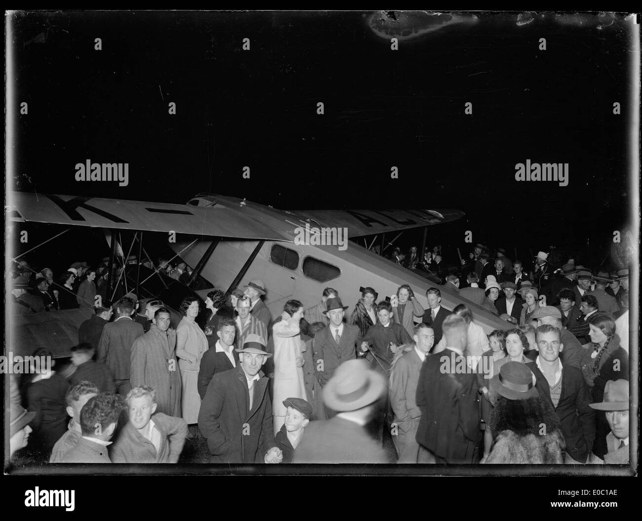 Crowd of people around a De Havilland DH89 Rapide plane, ca 1930s-1940s Stock Photo