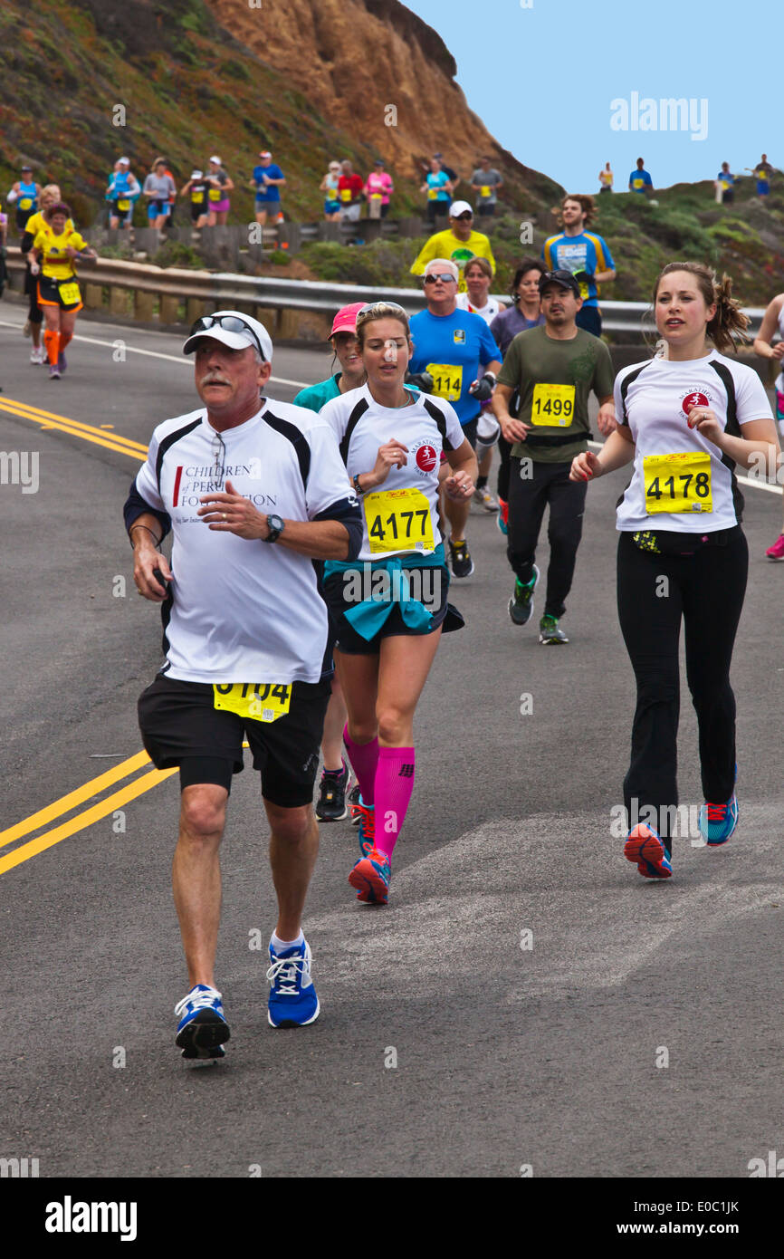 Runners on Highway 1 participate in the 2014 Big Sur Marathon - BIG SUR, CALIFORNIA Stock Photo