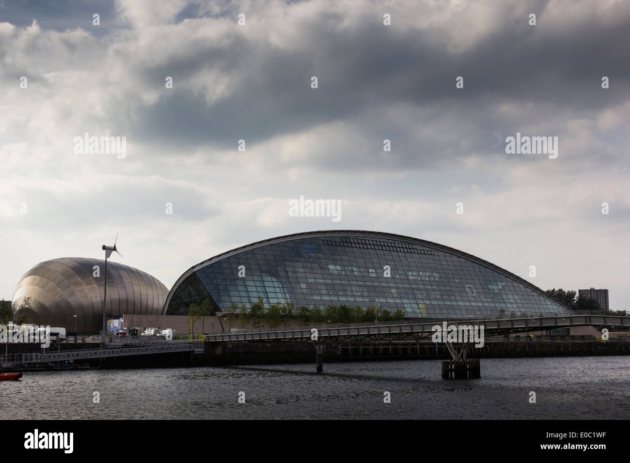 The Glasgow Science Center from the North side of the River Clyde, with Dark Clouds overhead. Stock Photo