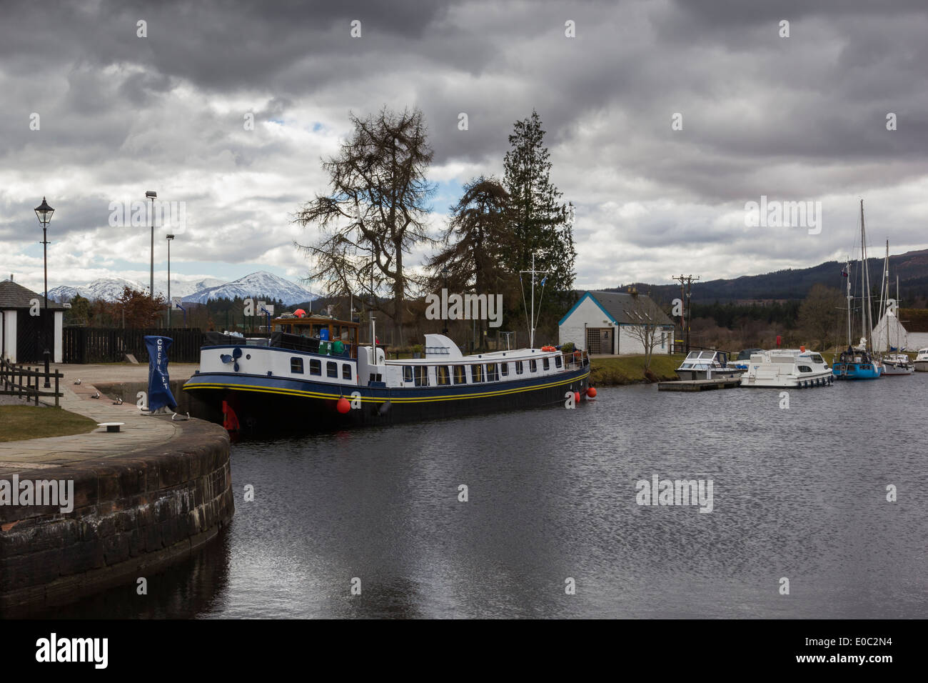 A Barge Boat Moored at the Head of the Fort Augustus locks, Caledonian Canal near Loch Ness Highland Scotland Stock Photo
