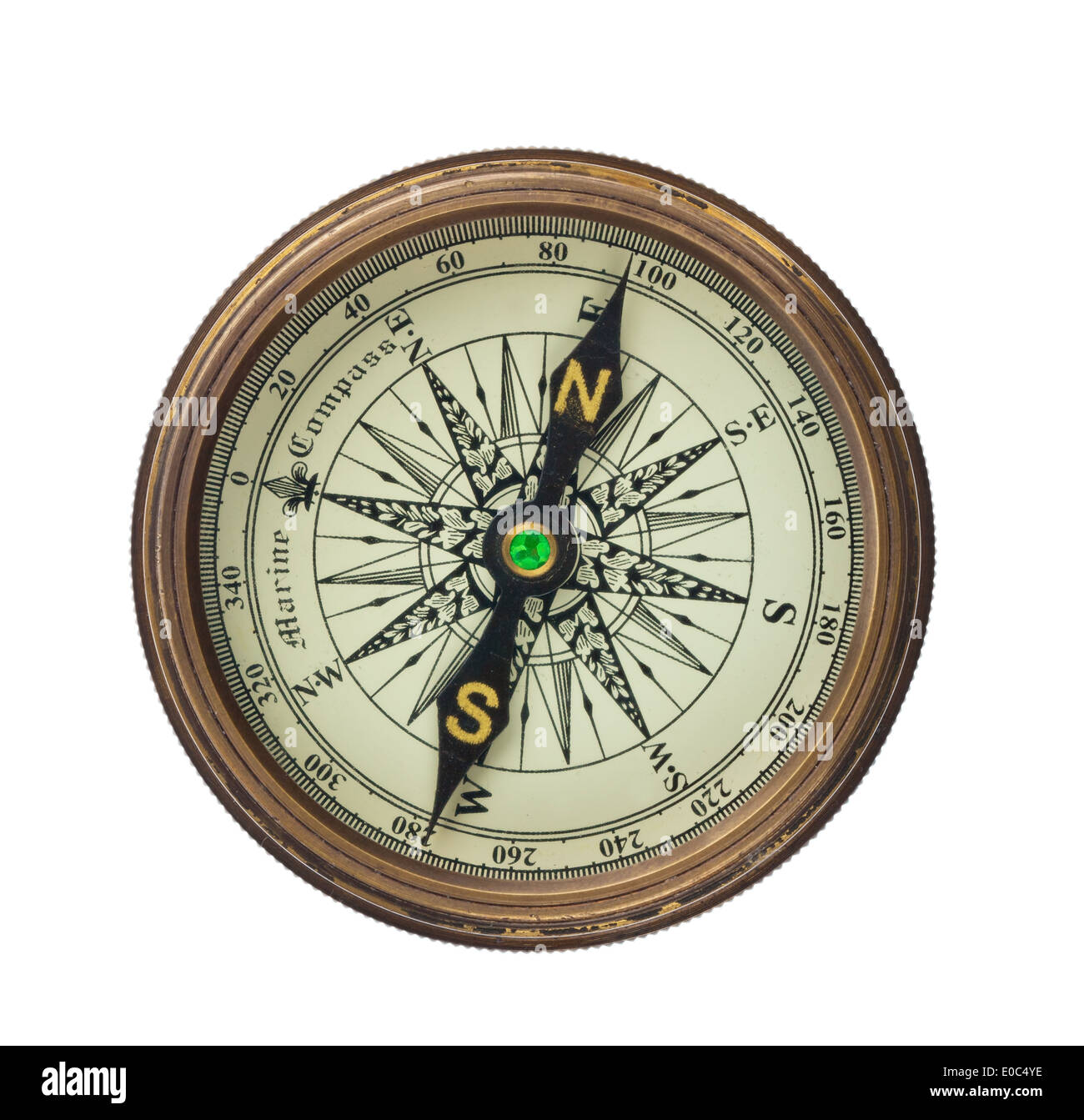 A compass lies on a white background., Ein Kompass liegt auf einem weissem Hintergrund. Stock Photo