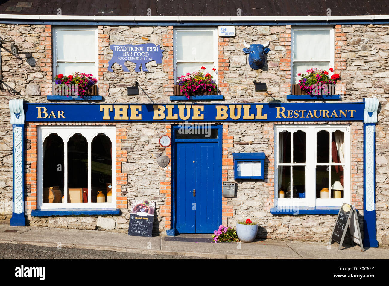 The Blue Bull Restaurant And Bar With Blue Sign And Door Sneem