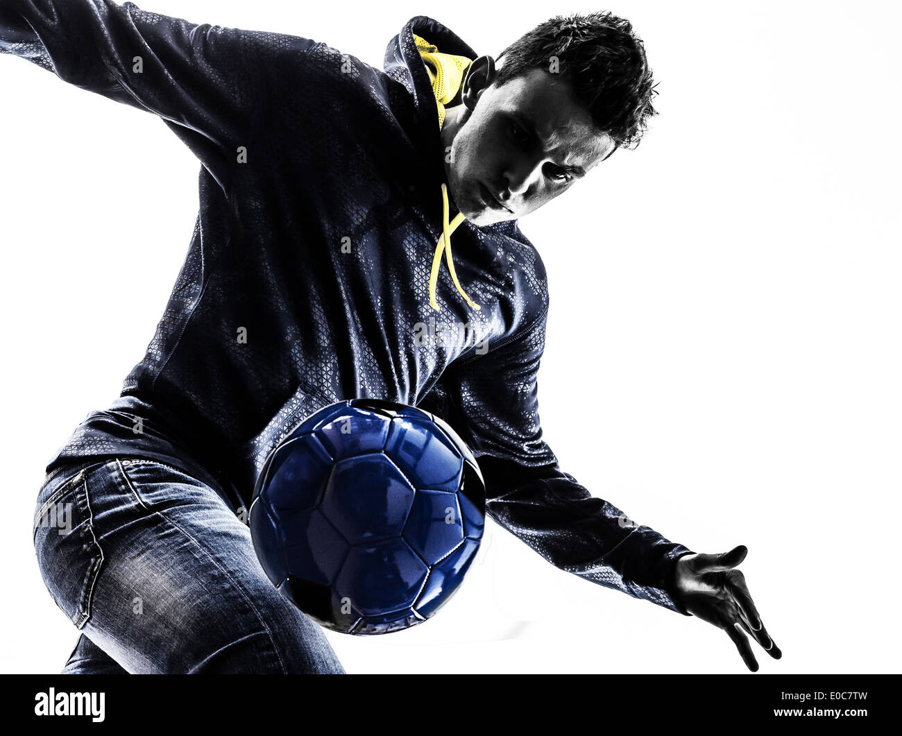 one young man soccer freestyler player in silhouette on white