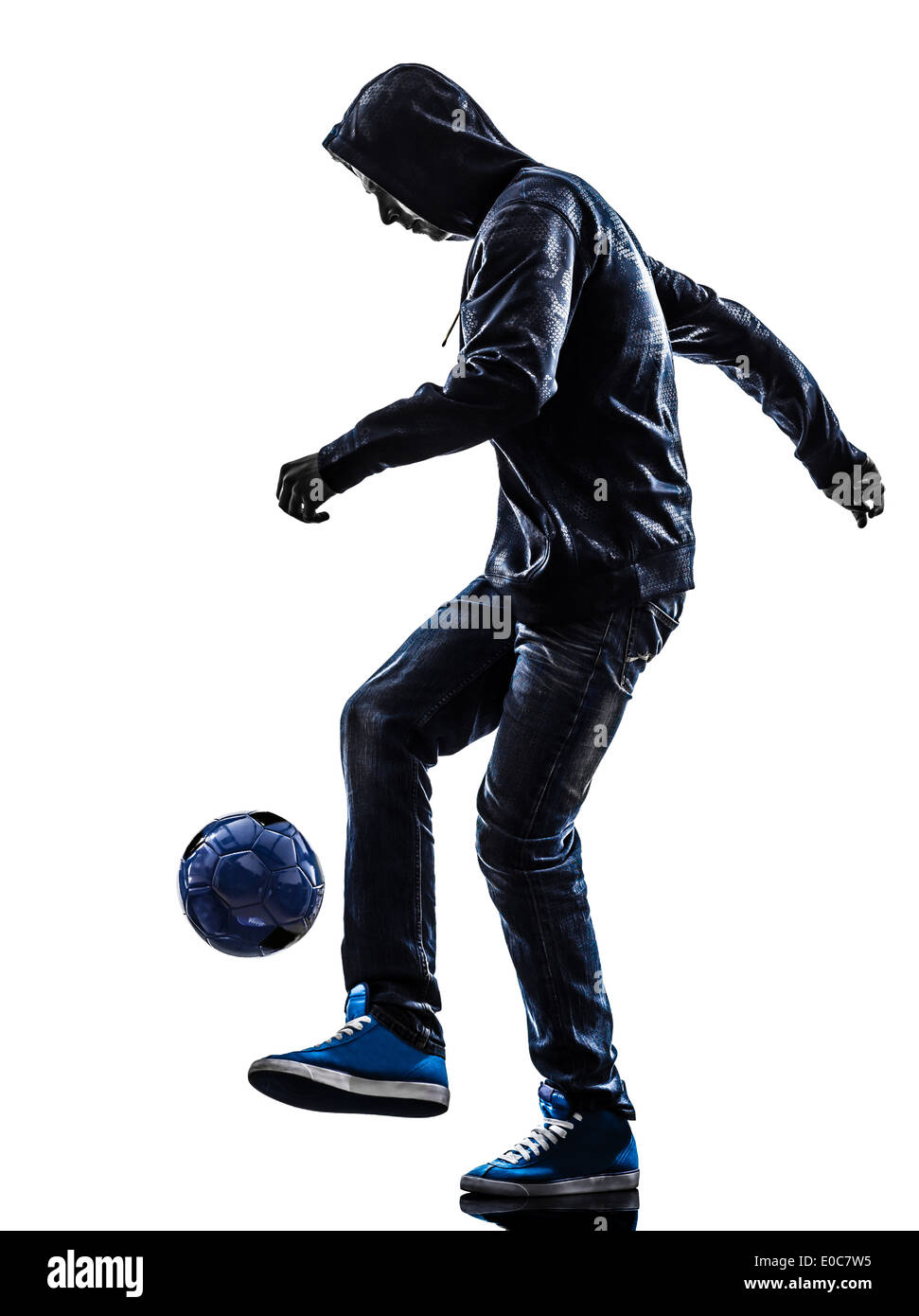 one young man soccer freestyler player in silhouette on white