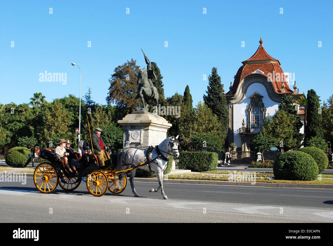 Portuguese Embassy on the Avenida del Cid at Glorieta San Diego with a horse drawn carriage in the foreground, Seville, Spain. Stock Photo