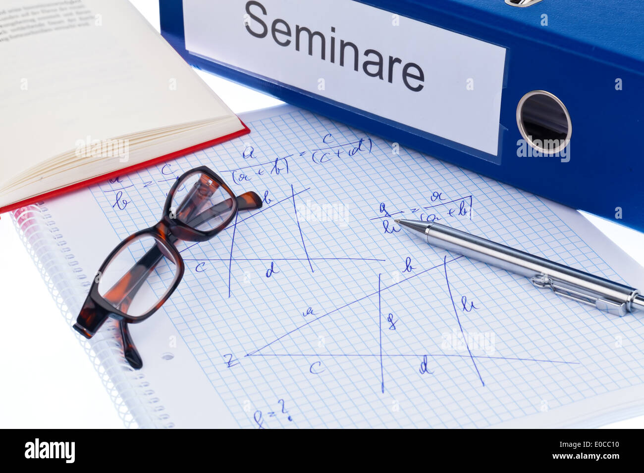 A symbolic photo for continuing education, advanced training and adult education. Briefcase and documents in a seminar, Ein Symb Stock Photo