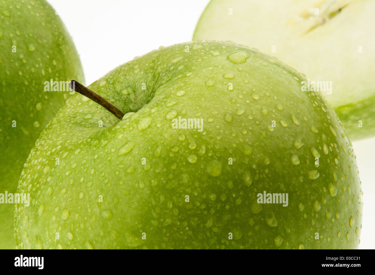 A green apple. Healthy and fresh fruit for vitamins., Ein gruener Apfel. Gesundes und frisches Obst fuer Vitamine. Stock Photo