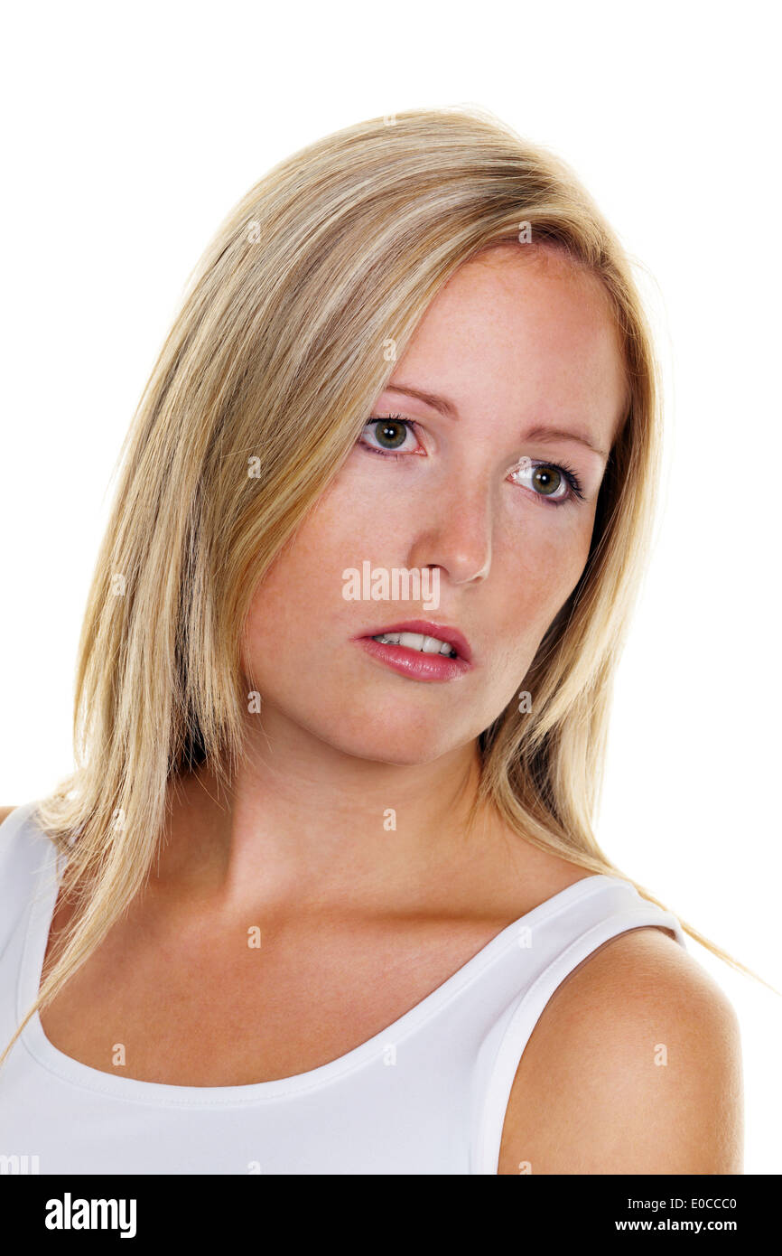 Portrait of a young blond woman with freckles before white background, Portraet einer jungen blonden Frau mit Sommersprossen vor Stock Photo