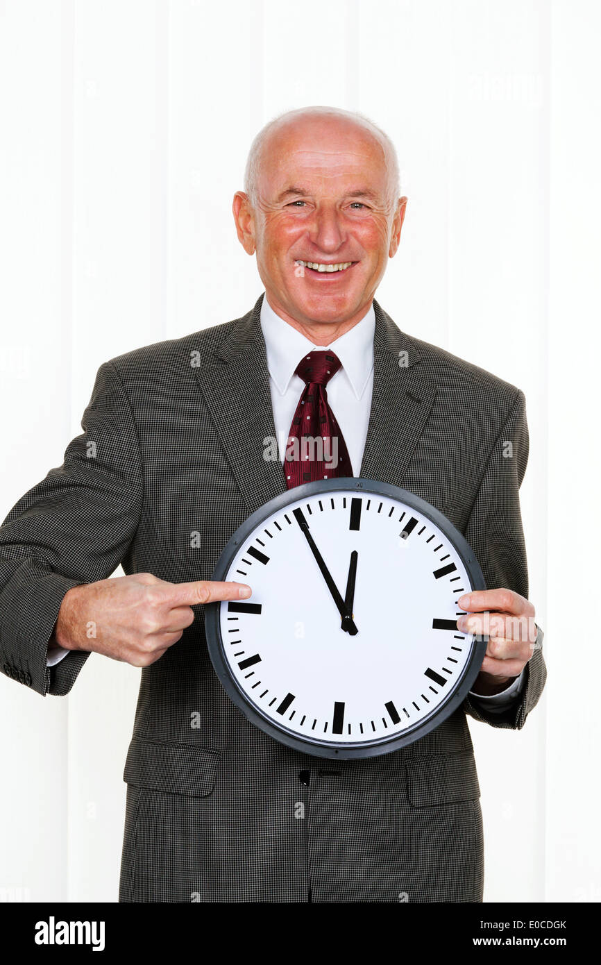 manager holds a clock Stock Photo