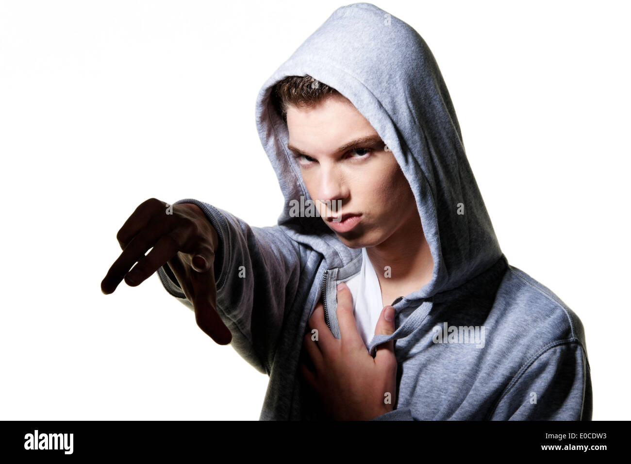 A cool looking youthful man with bonnet, Ein cool blickender Jugendlicher Mann mit Haube Stock Photo