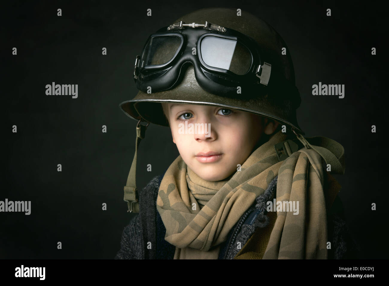 Young boy soldier in a dark background Stock Photo Alamy
