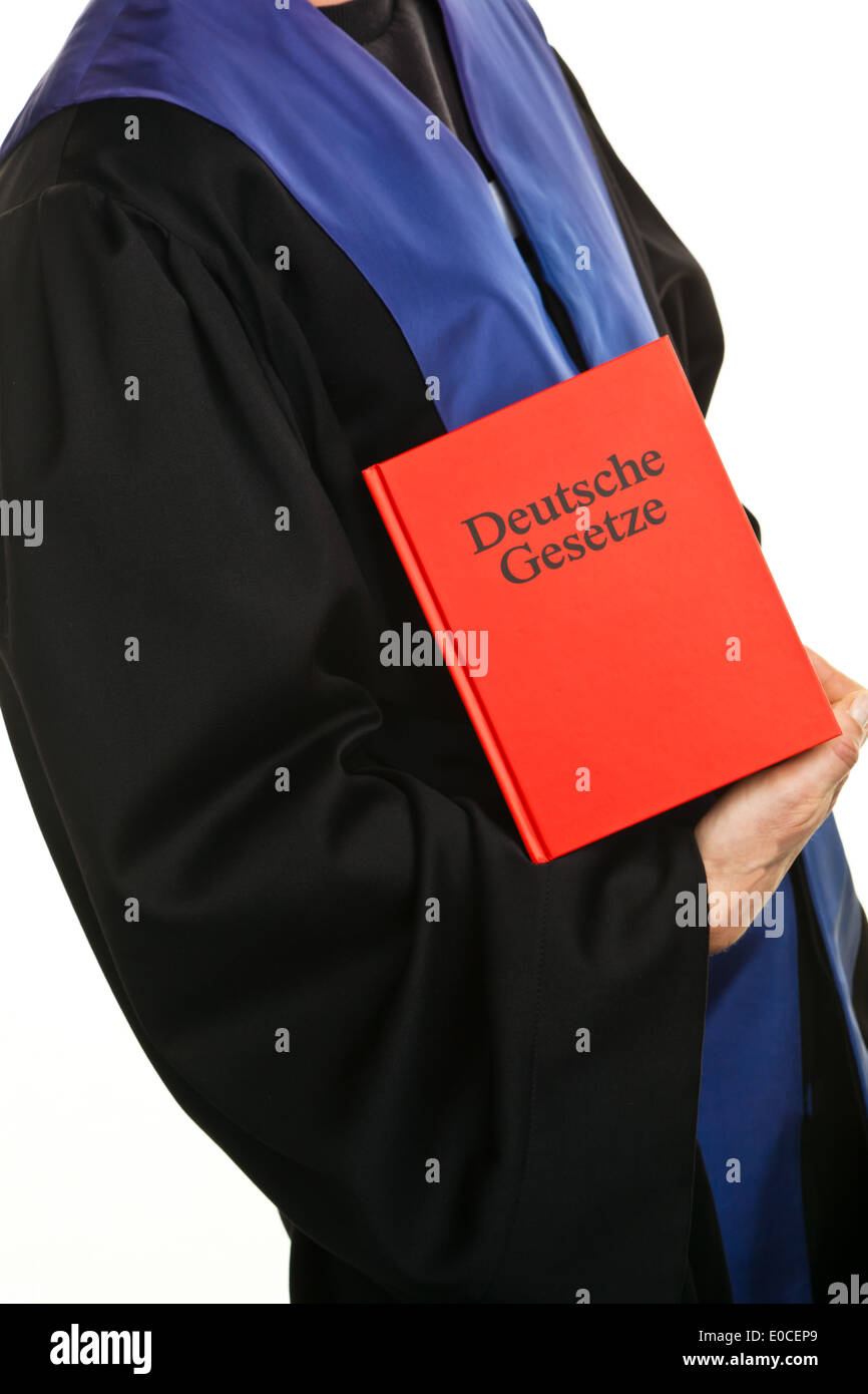 A judge with a German code at court, Ein Richter mit einem deutschen Gesetzbuch bei Gericht Stock Photo