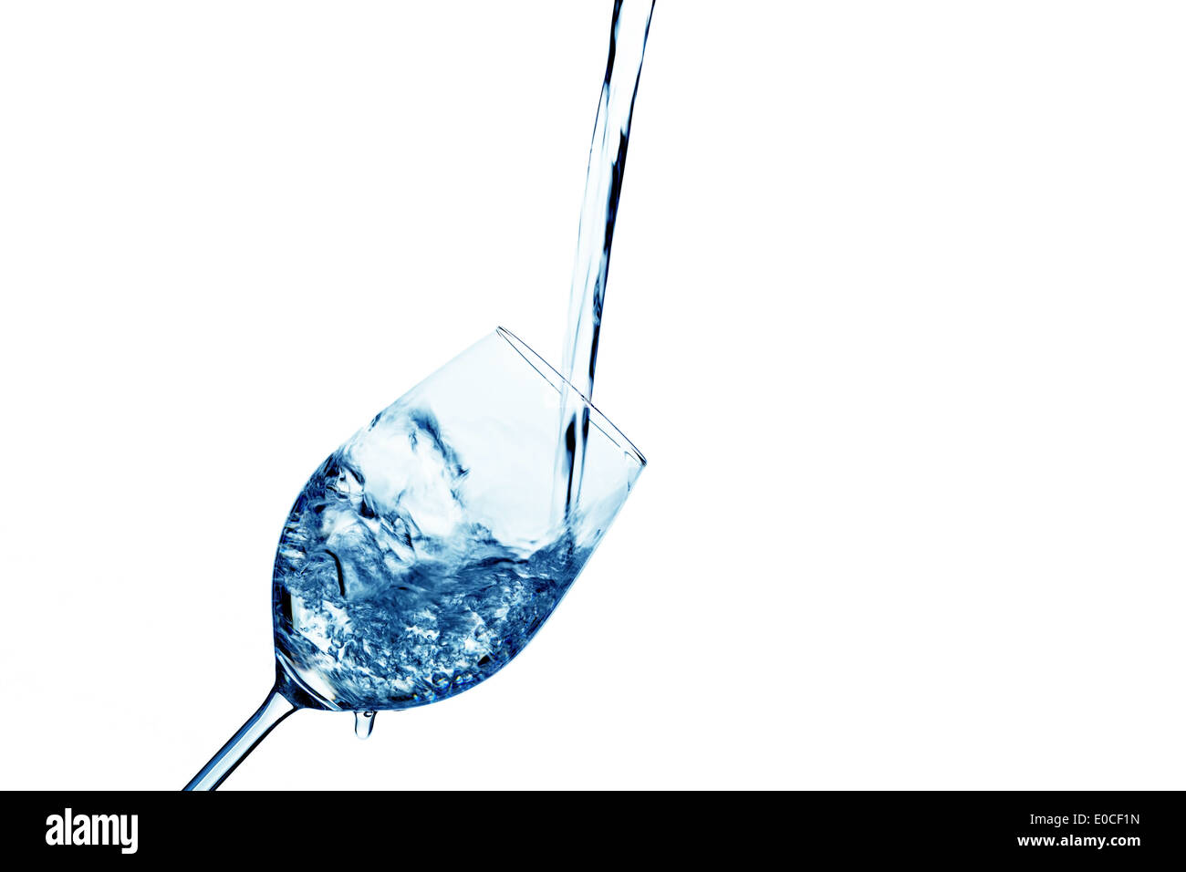 Pure and clean water is filled in a glass. Drinking water in the water glass., Reines und sauberes Wasser wird in ein Glas einge Stock Photo