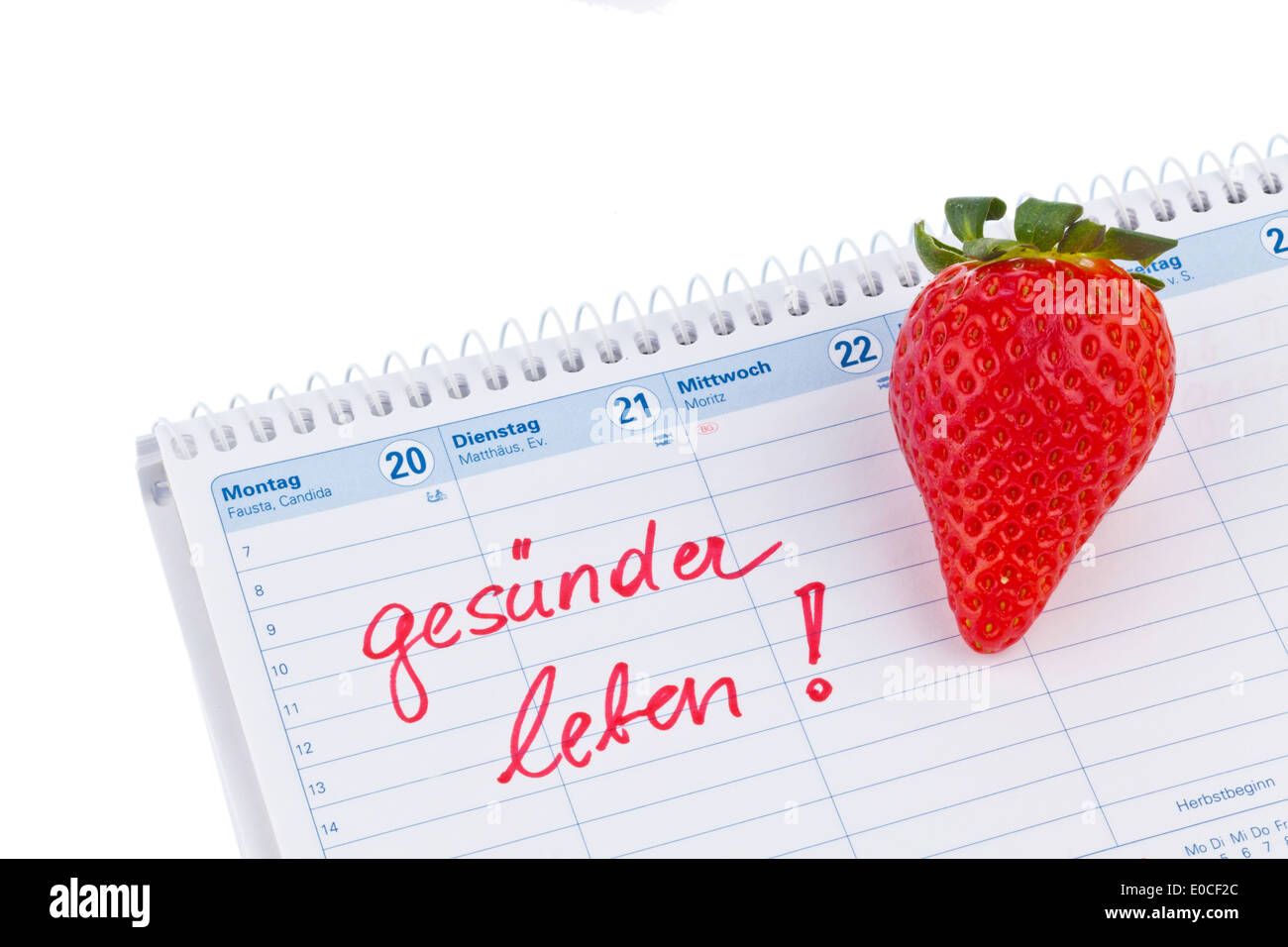 Strawberry and calendar. Good intention to the healthy food, Erdbeere und Kalender. Guter Vorsatz zur Gesunden Ernaehrung Stock Photo