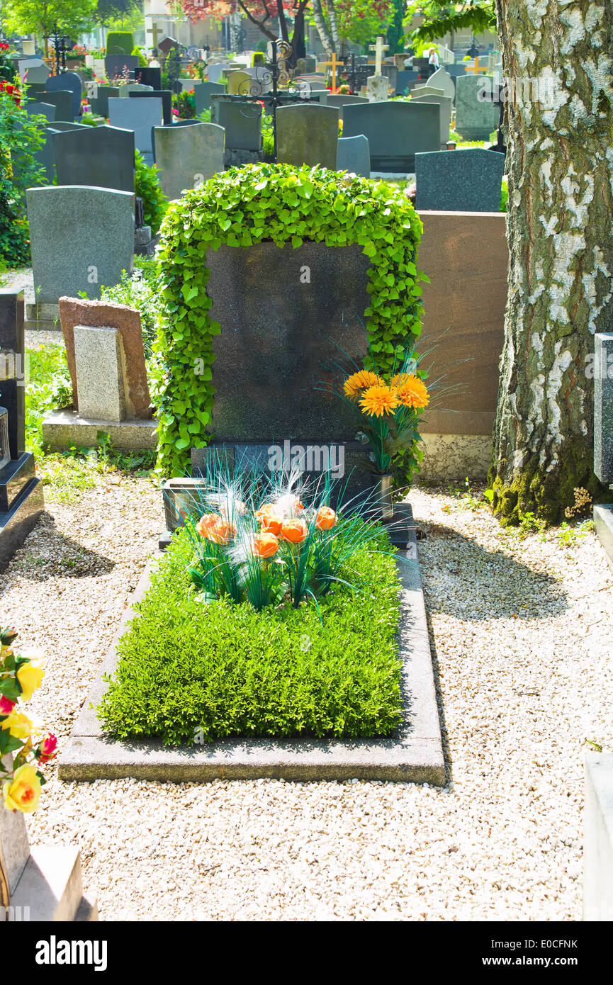 The gravestone of a Gramals on a cemetery in memory of the deads, Der Grabstein eines Gramals auf einem Friedhof zur Erinnerung Stock Photo