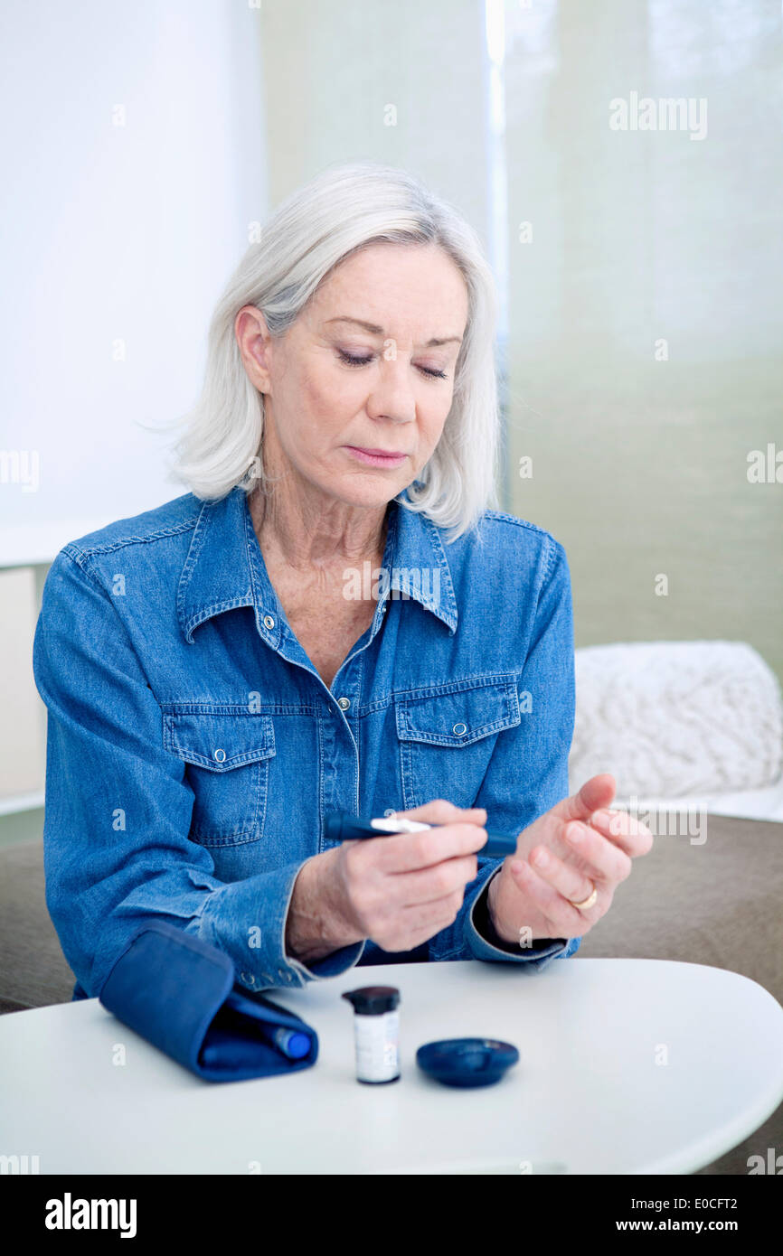 Test for diabetes, elderly person Stock Photo