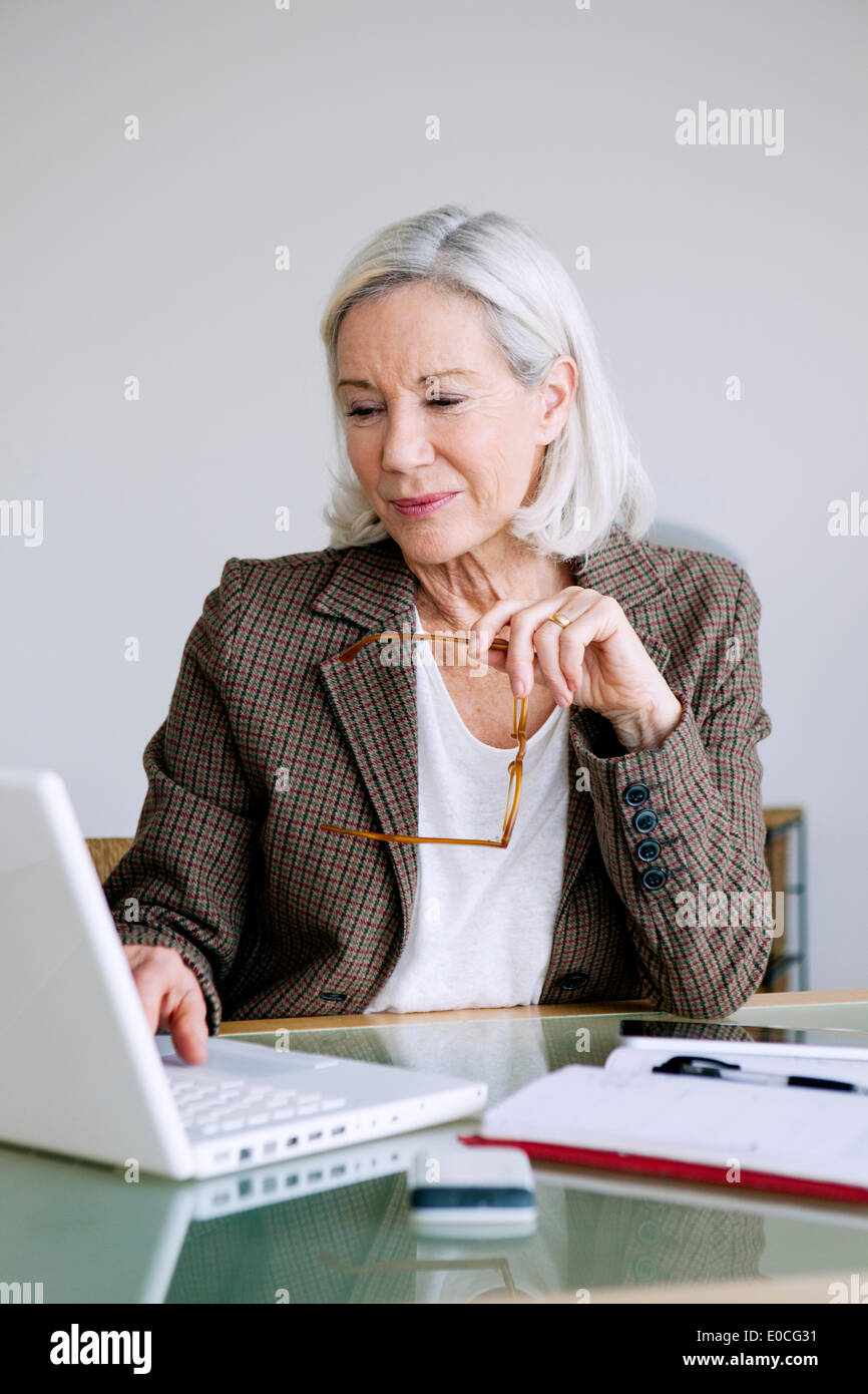 Elderly person teleworking Stock Photo