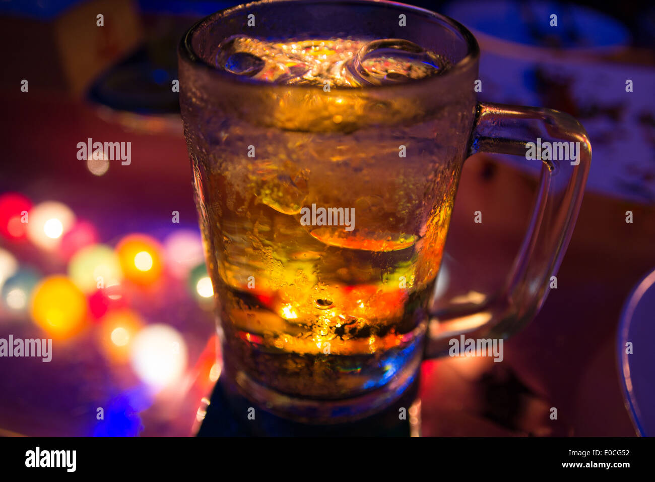 Glass of beer with night scene Stock Photo