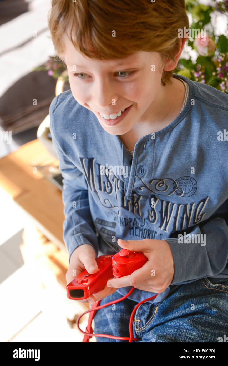 Child playing with video game Stock Photo