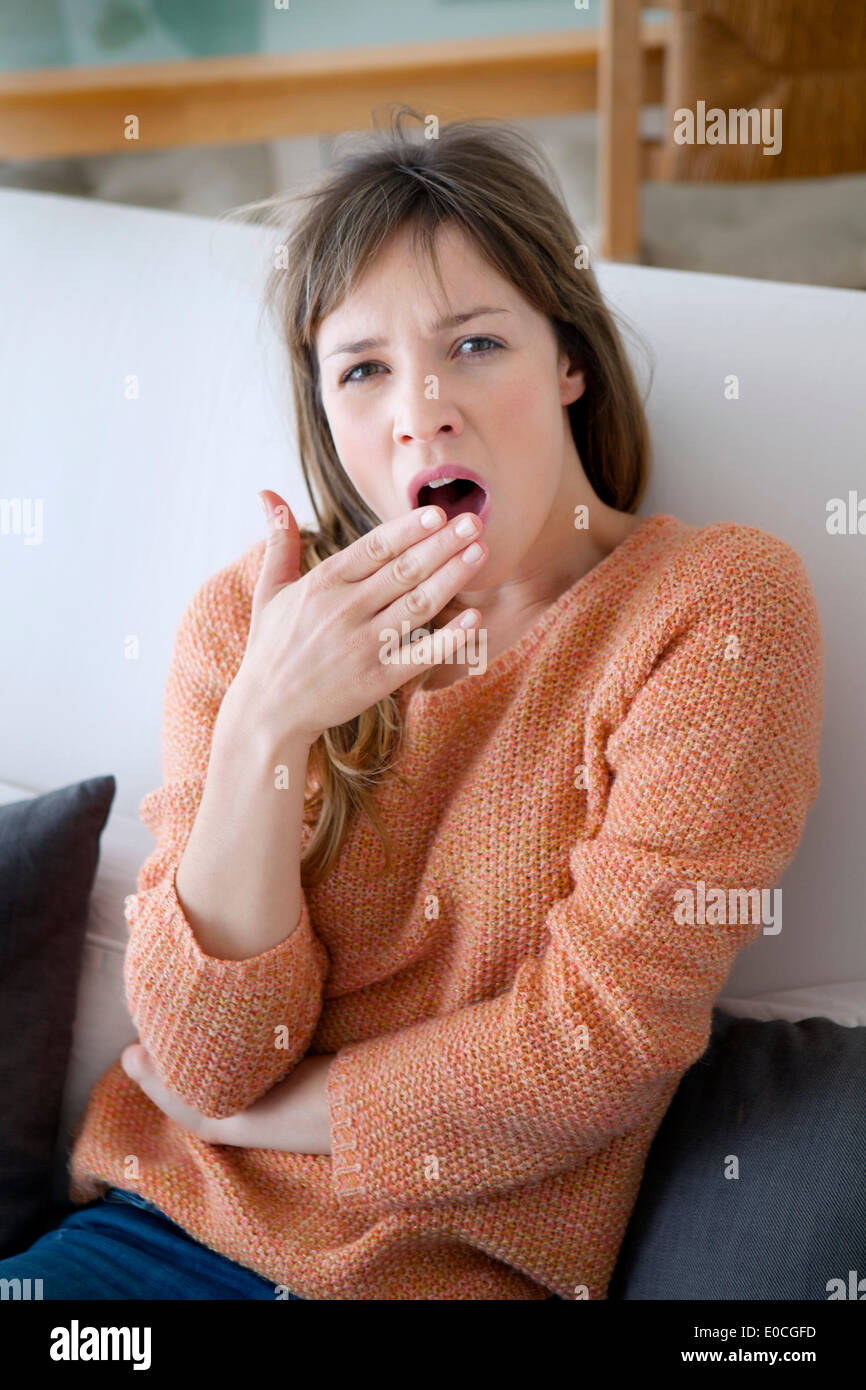 Yawning woman Stock Photo