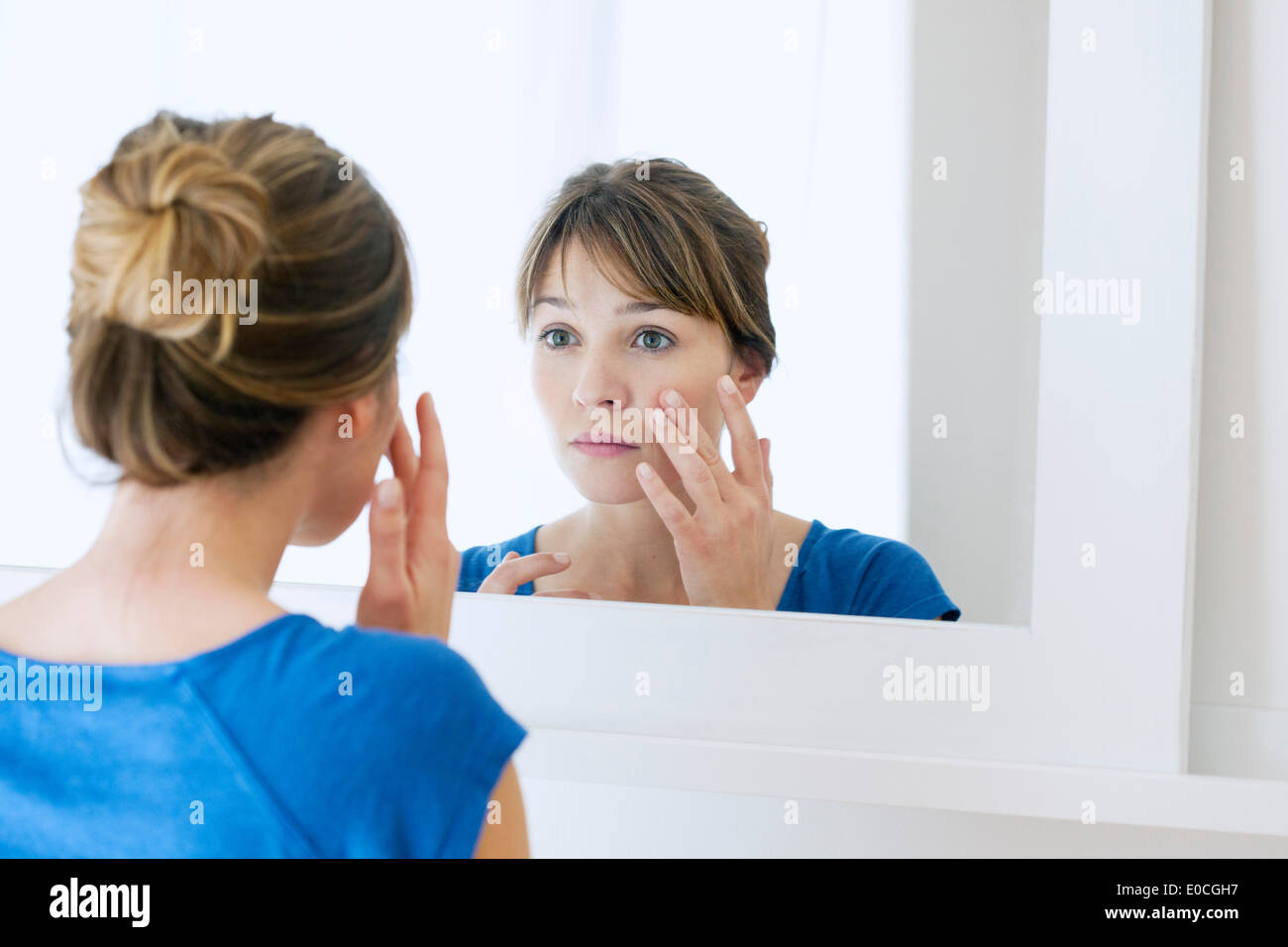 Woman with mirror Stock Photo