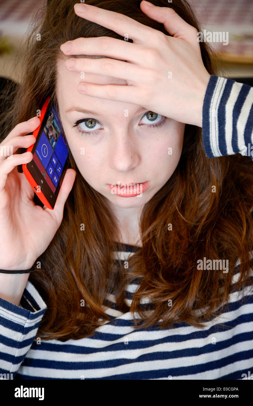 Adolescent with phone Stock Photo