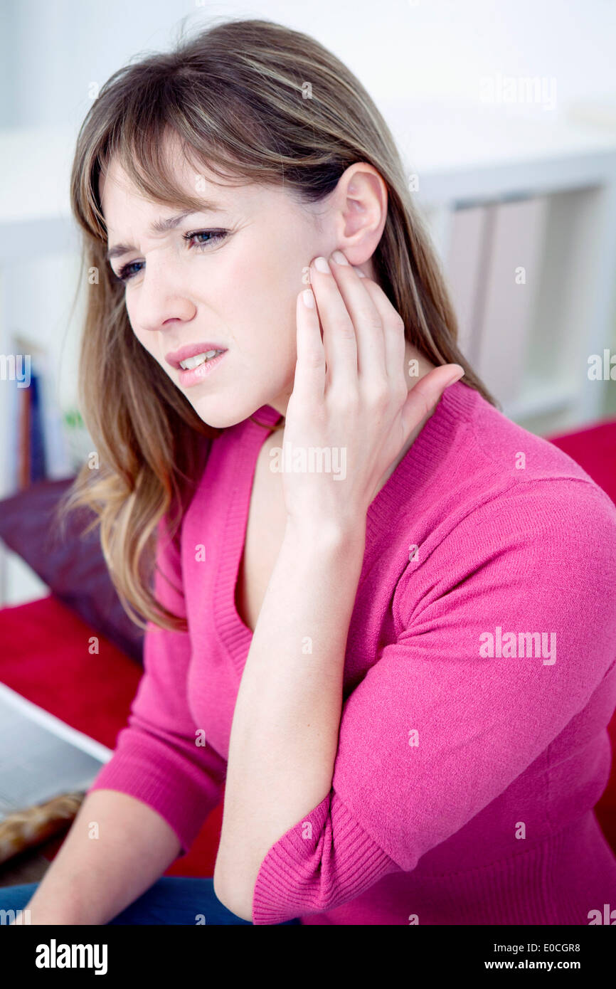 Ear pain in a woman Stock Photo