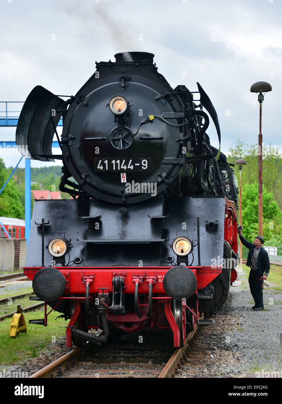 Engineer Matthias Boese polishes a 41 series locomotive from 1938 during the 100th birthday of the Meiningen steam locomotive factory in Meiningen, Germany, 09 May 2014. It is the 100th anniversary of the founding of the factory. Photo: MARTIN SCHUTT/dpa Stock Photo