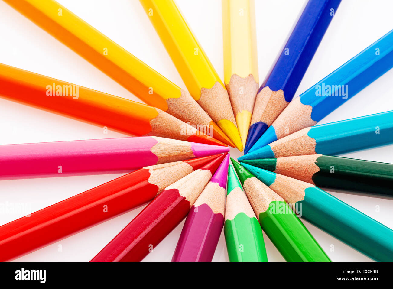 Many different coloured colour pencils on wei? ?? to em background., Viele verschiedene bunte Farbstifte auf einem weiﬂem Hinter Stock Photo