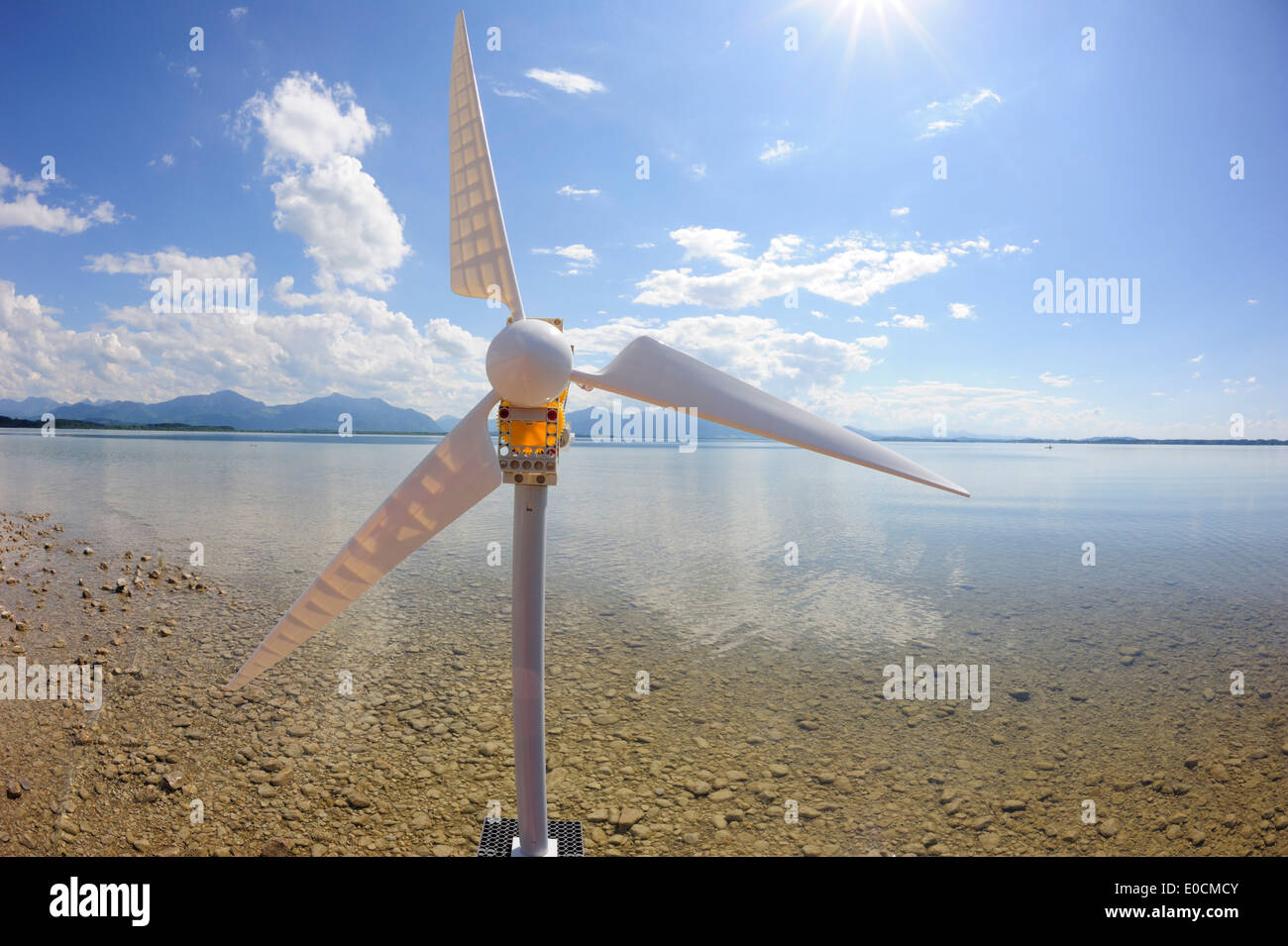 Model of wind power plant at shore of lake producing electricity, lake Chiemsee, Chiemgau, Upper Bavaria, Bavaria, Germany, Euro Stock Photo