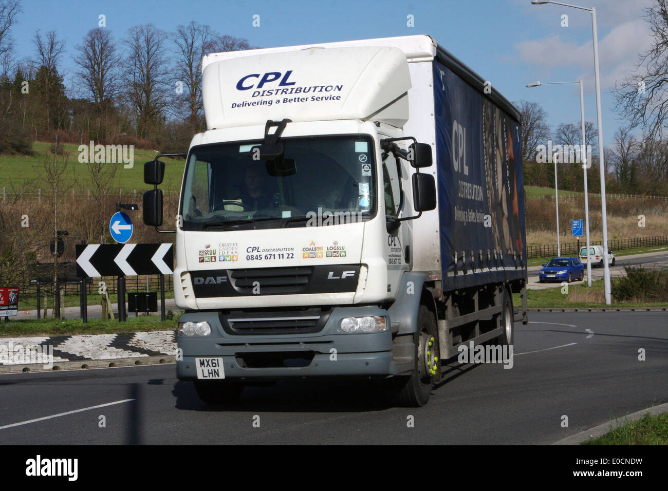 A CPL Distribution truck traveling around a roundabout in Coulsdon, Surrey, England Stock Photo