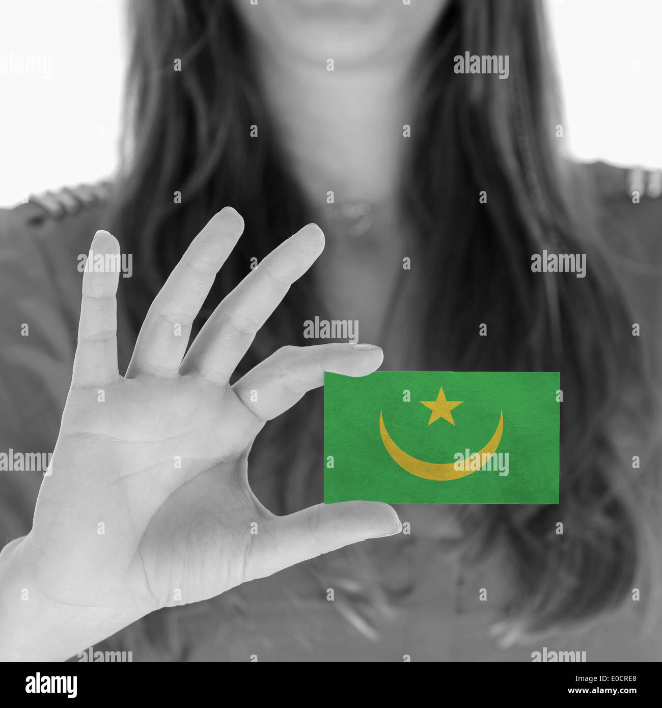 Woman showing a business card  black and white  Mauritania Stock Photo