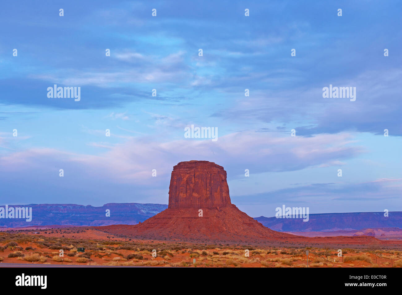 Butte in Monument Valley under clouded sky, Navajo Tribal Park, Navajo Indian Reservation, Arizona, USA, America Stock Photo