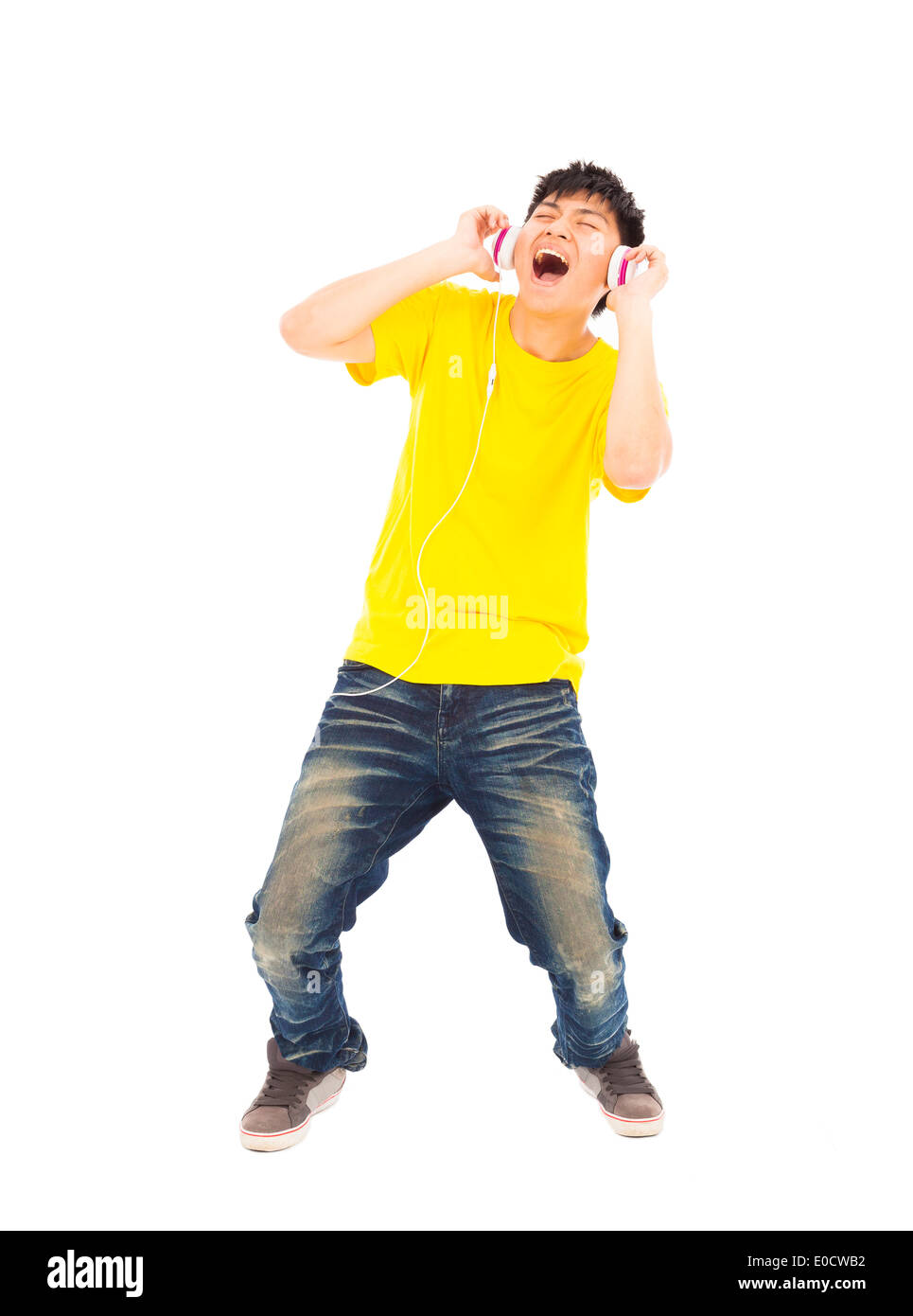 young man singing while listening music Stock Photo