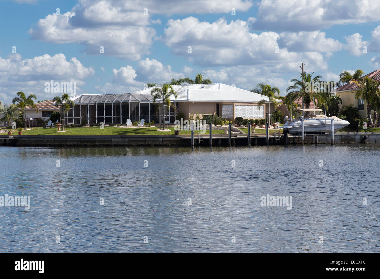 Luxury Residential Canal Front Home with Screened in Pool Deck and