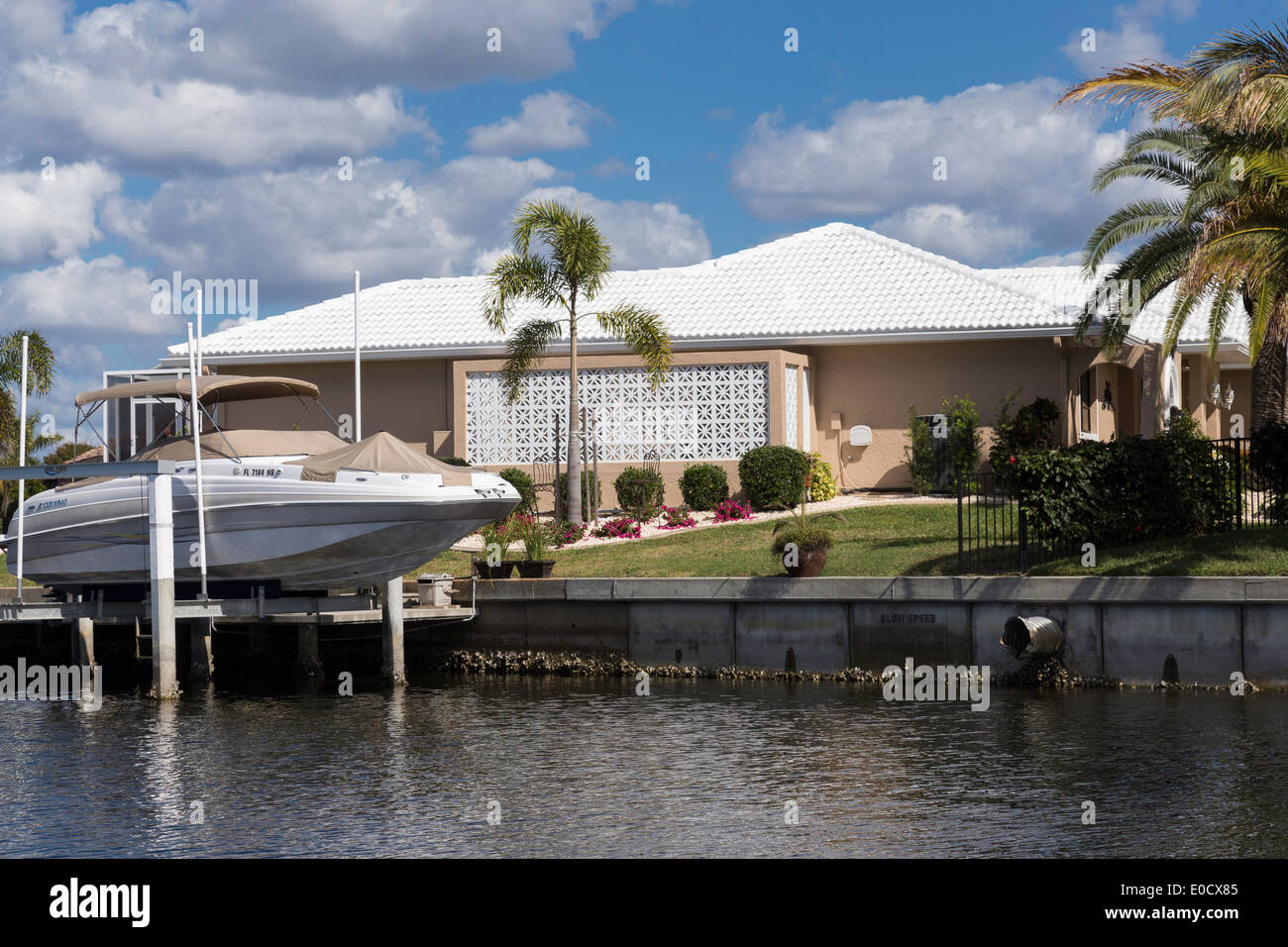 Luxury Residential Canal Front Home with Screened in Pool Deck and