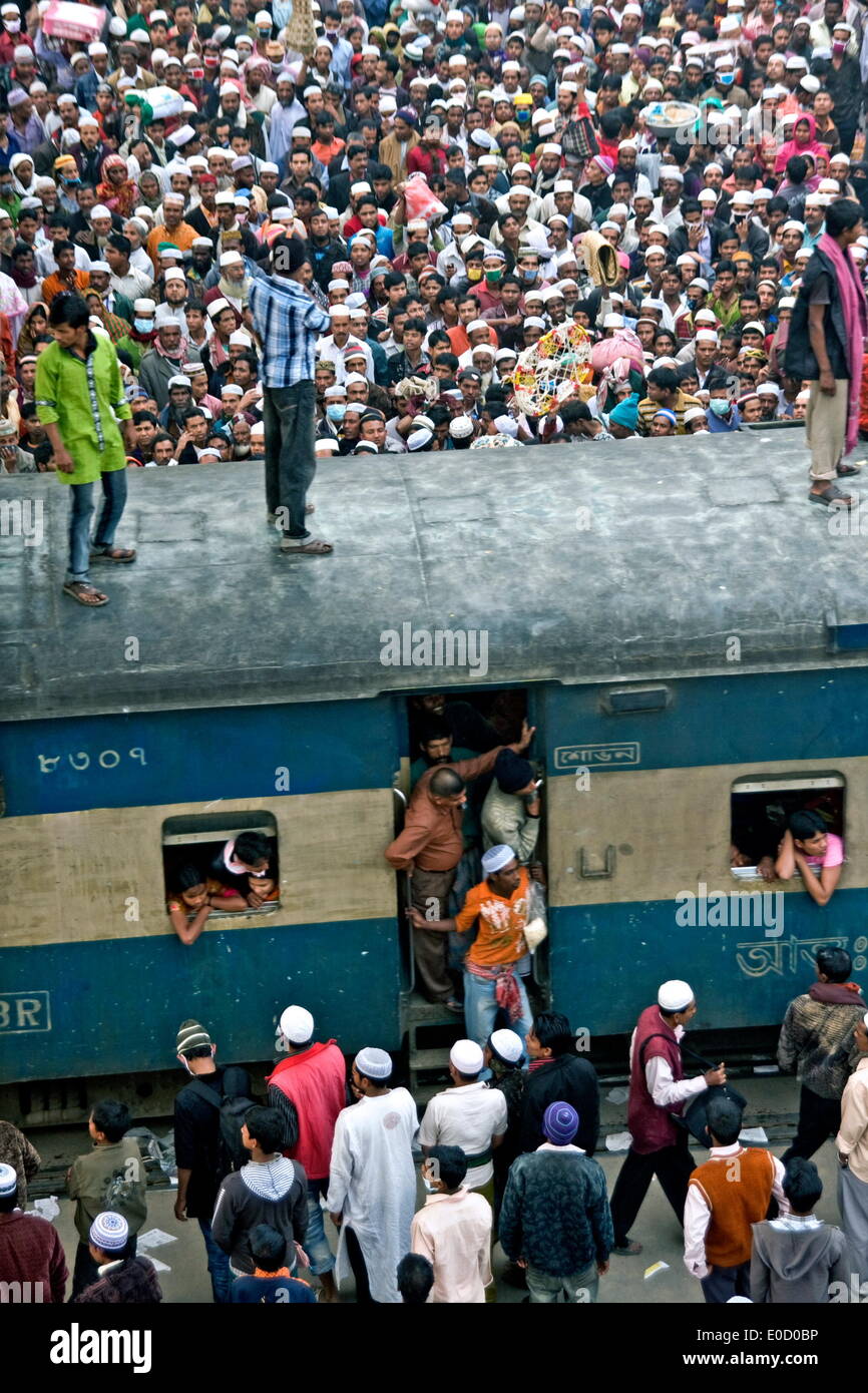 Overcrowded Station, People are surfing the train return for home after the Akheri Munajat. Bishwa Ijtema,Tongi.Bishwa Ijtema,Tongi.Bishwa Ijtema (or Bishsho Istema the World or Global Congregation or Meeting) is an annual Tablighi Jamaat Islamic movement congregation held at Tongi, Bangladesh by the river Turag. It is the 2nd largest Muslim congregation in the world after the Hajj. The event focuses on prayers and supplication and does not allow political discussion.The local police estimated the number of attendees of 2007 ijtema to be 3 million while in 2010 the number of attendees was 5 mi Stock Photo