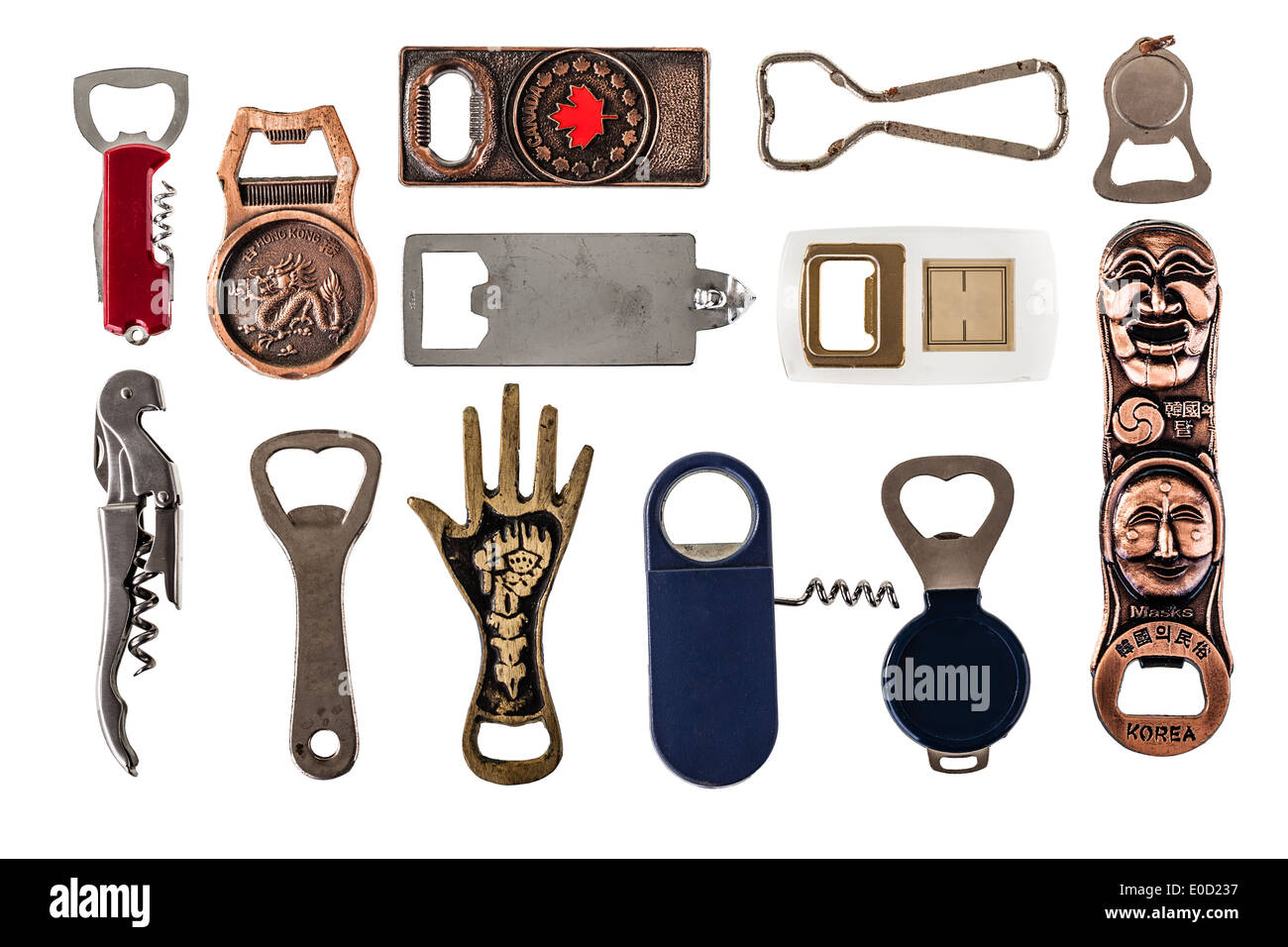 a collection of many different bottle openers isolated on a white